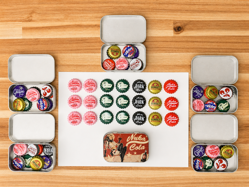 A flat-lay display of vintage-style metal tin collectibles and bottle cap bookmarks arranged on a light wood background. The set includes several silver metal tins filled with colorful bottle caps, a white sheet with rows of bottle cap bookmarks in pink, green, black, red, and white, and a small rectangular tin featuring a retro 'Nuka-Cola' advertisement design.
